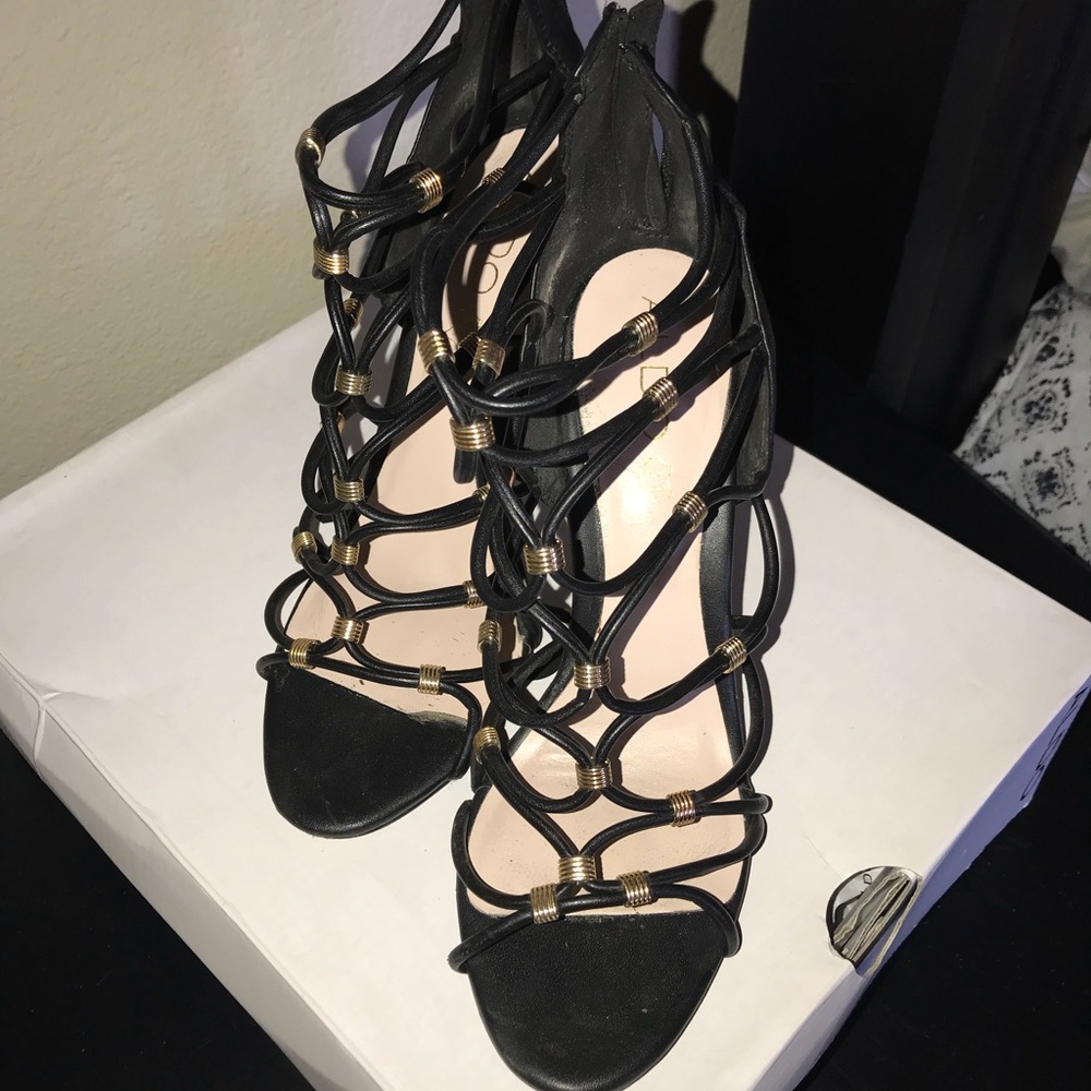 Black strapped heel with gold studs